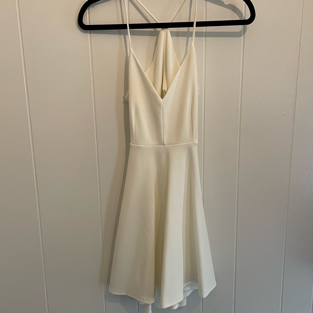 White, open back, mini dress.